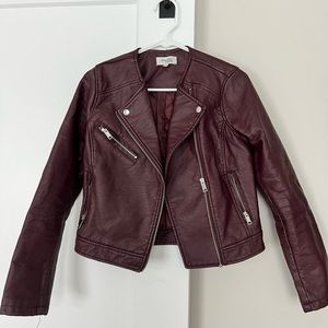 Burgundy faux leather biker jacket.